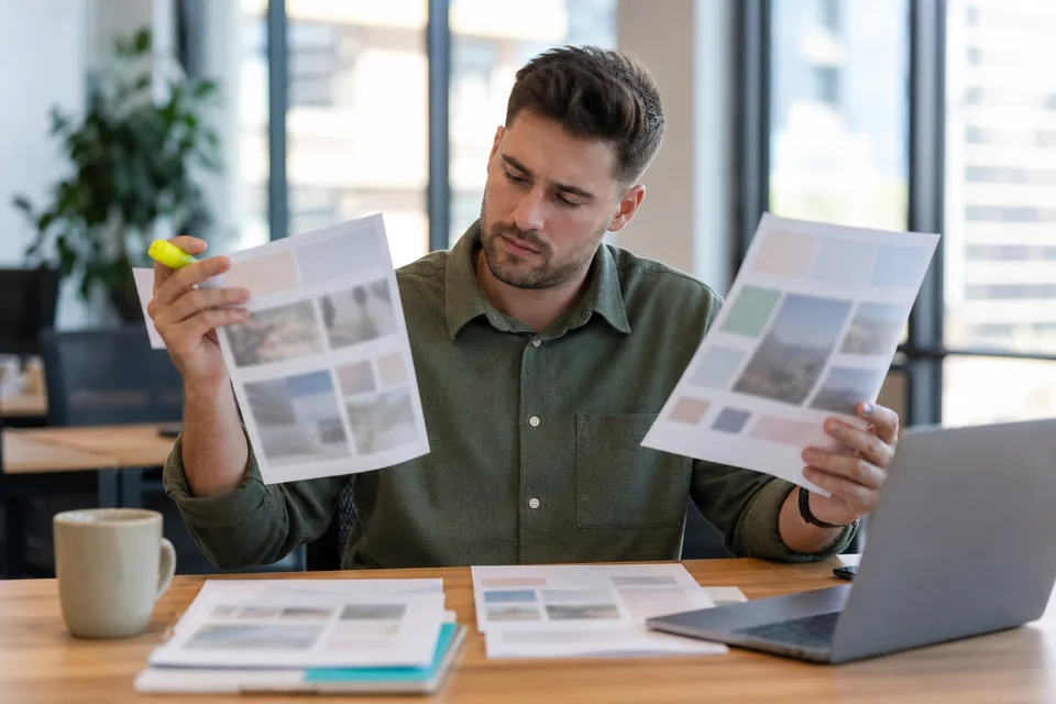 SEO manager comparing two publisher shortlists before ordering a backlink placement